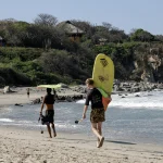 La Punta, Puerto Escondido, Oaxaca Mexico. January 12, 2023. Surf lessons for tourists on the beaches of La Punta, Puerto Escondido Oaxaca.